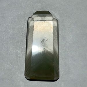 Quartz Crystal with multiple green pyramids inside.